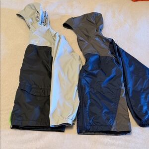 Two Columbia Kids' Two-Tone Rain Jackets in Light Gray/Black and Navy/Gray
